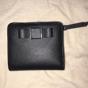 mini leather COACH wallet with adorable bow